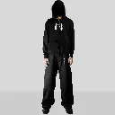 KOUPE TET ZIPUP HOODIE BLACK HOOD ON model images.webp